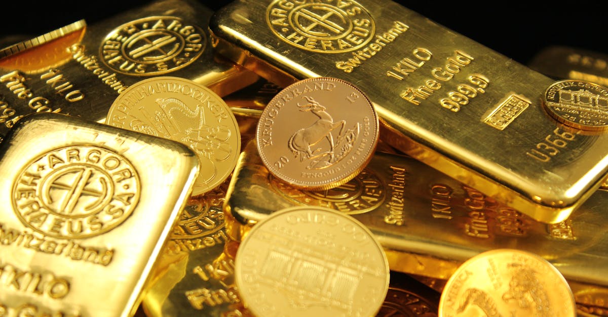 Gold and silver coins and bullion bars stacked together