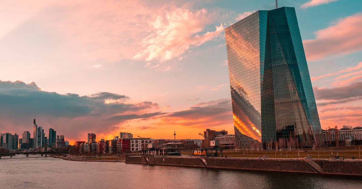 European Central Bank tower in Frankfurt at sunset above the river Main