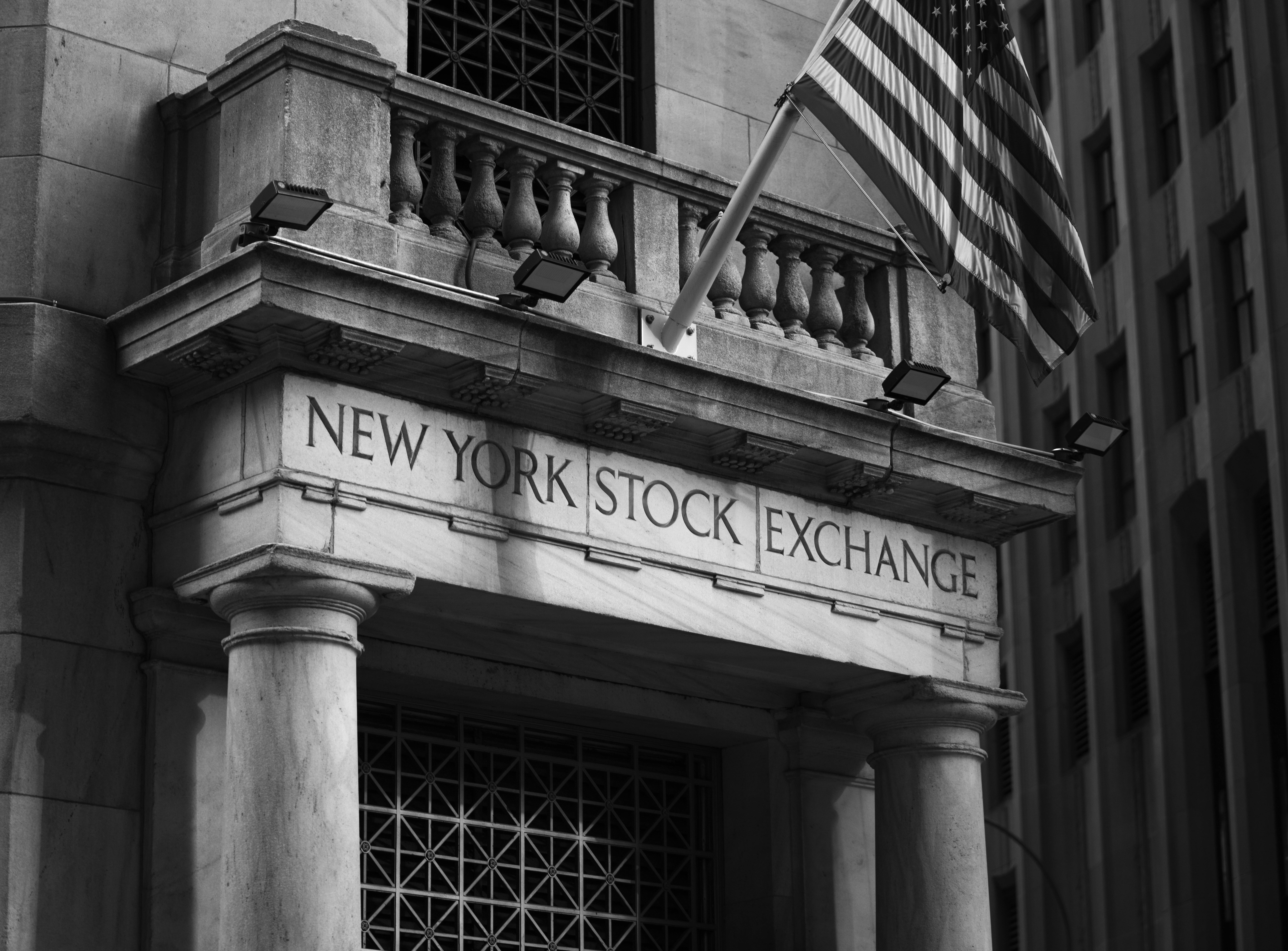 New York Stock Exchange building facade with American flag