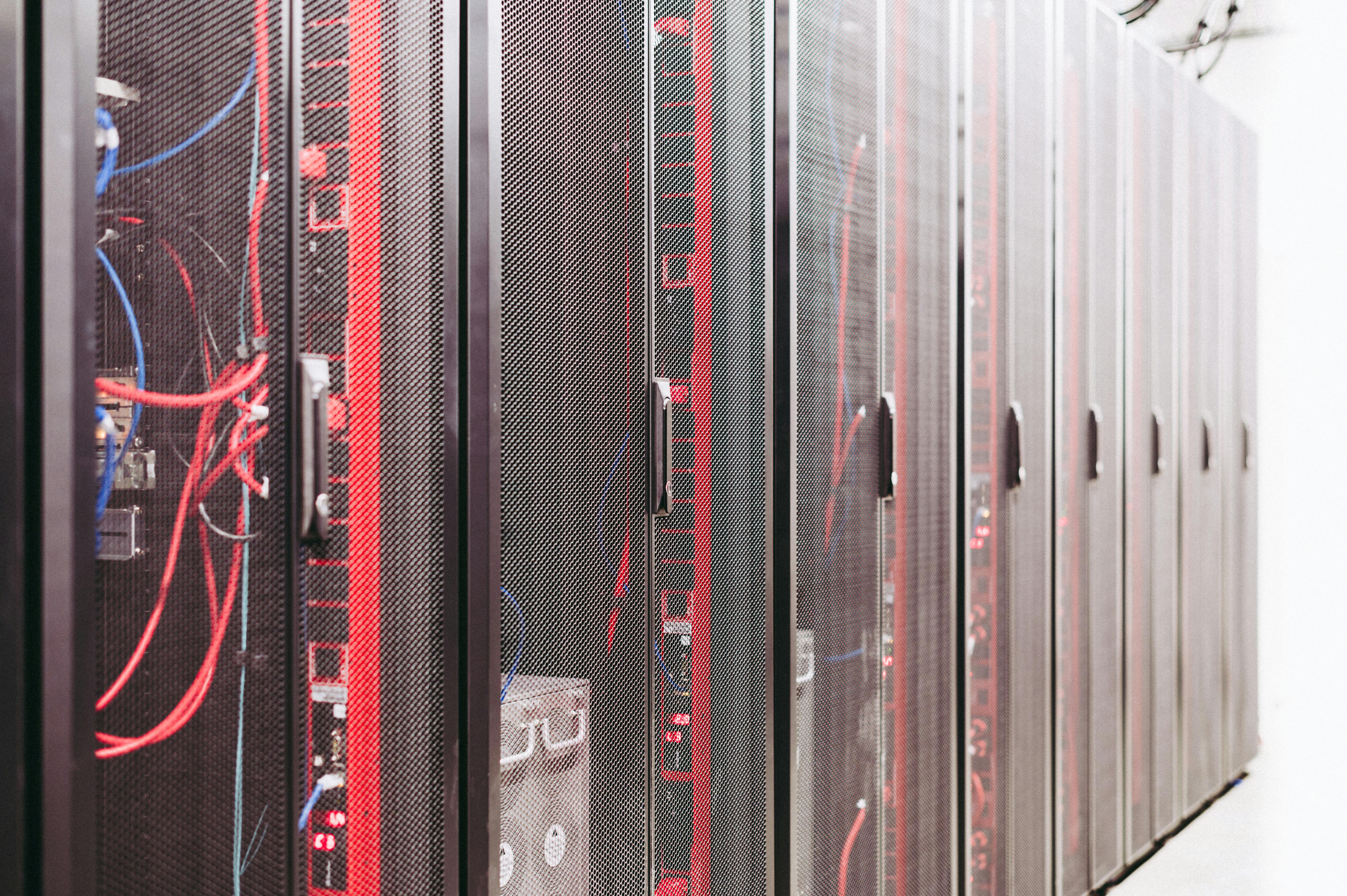 Server racks with networking cables in a modern data centre
