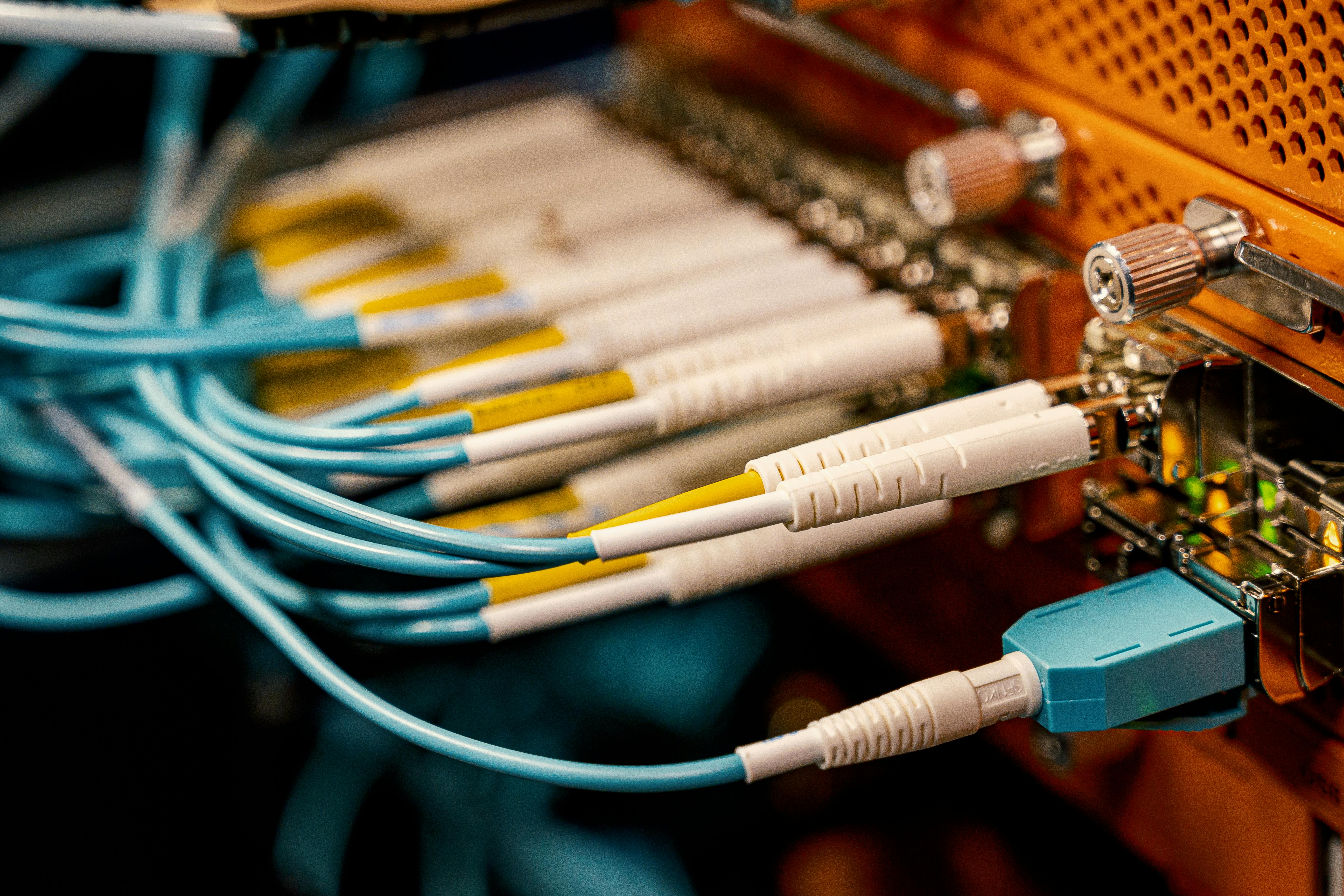Fiber optic switch with connected rubber cables in a data center