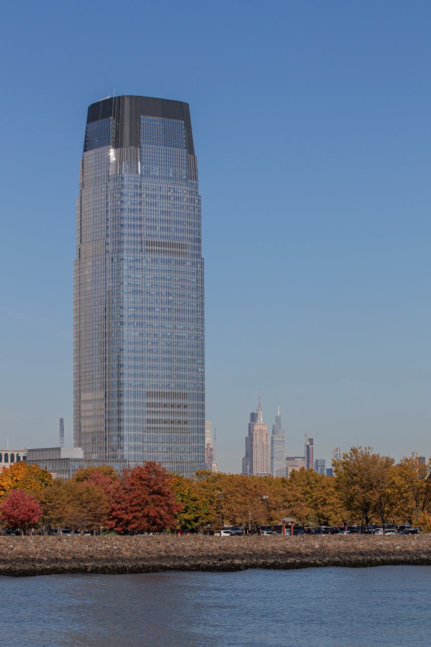 Goldman Sachs Tower in Jersey City, New Jersey, framed by autumn foliage