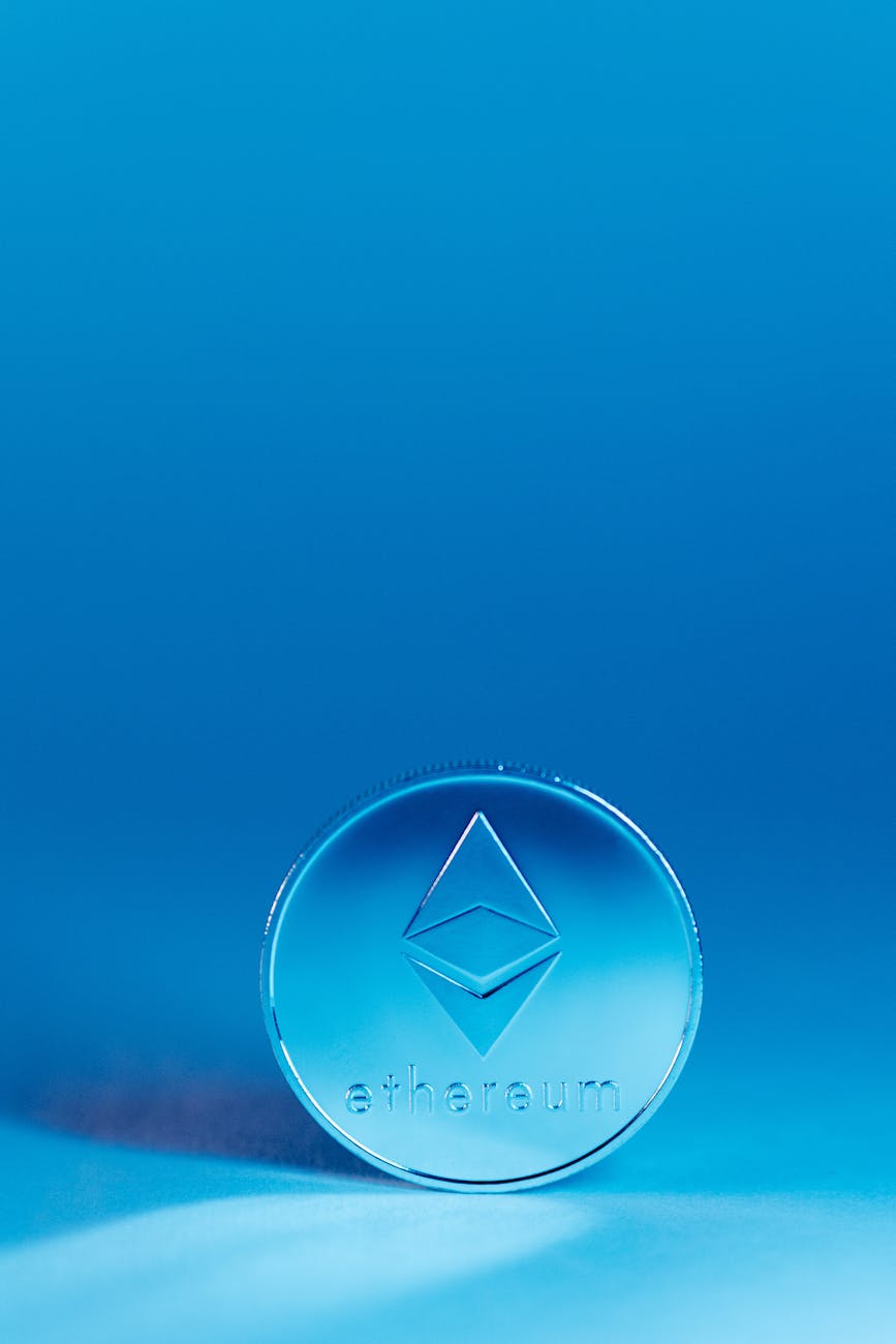 Close-up of an Ethereum coin against a blue background, symbolizing tokenized finance
