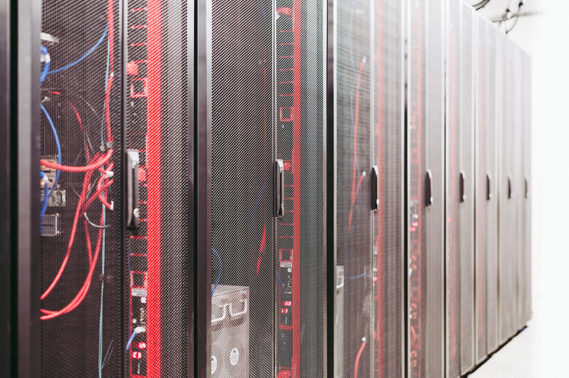Server racks and cabling inside a data center, illustrating bitcoin mining infrastructure