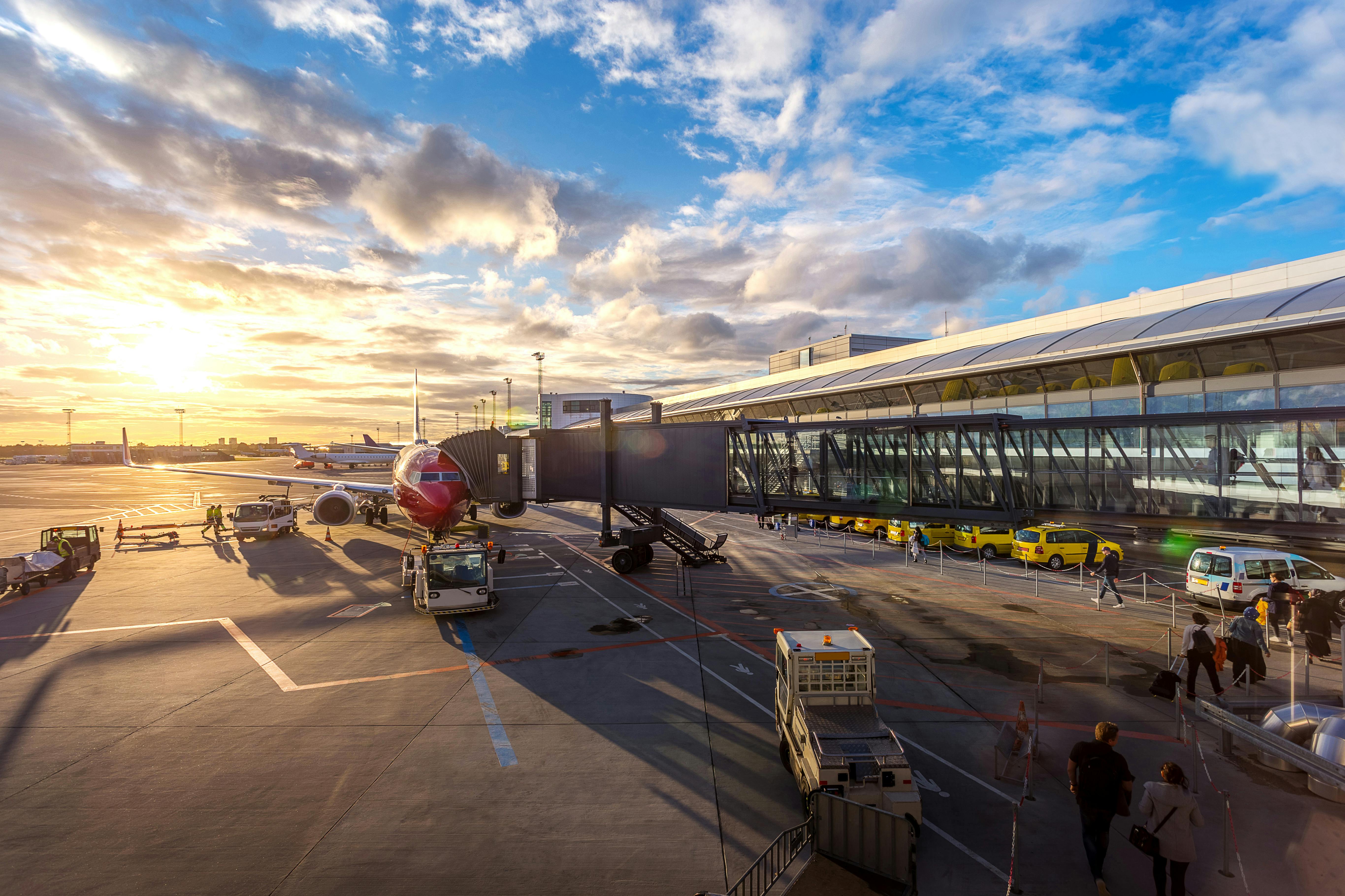Commercial passenger jet at gate, airline merger context