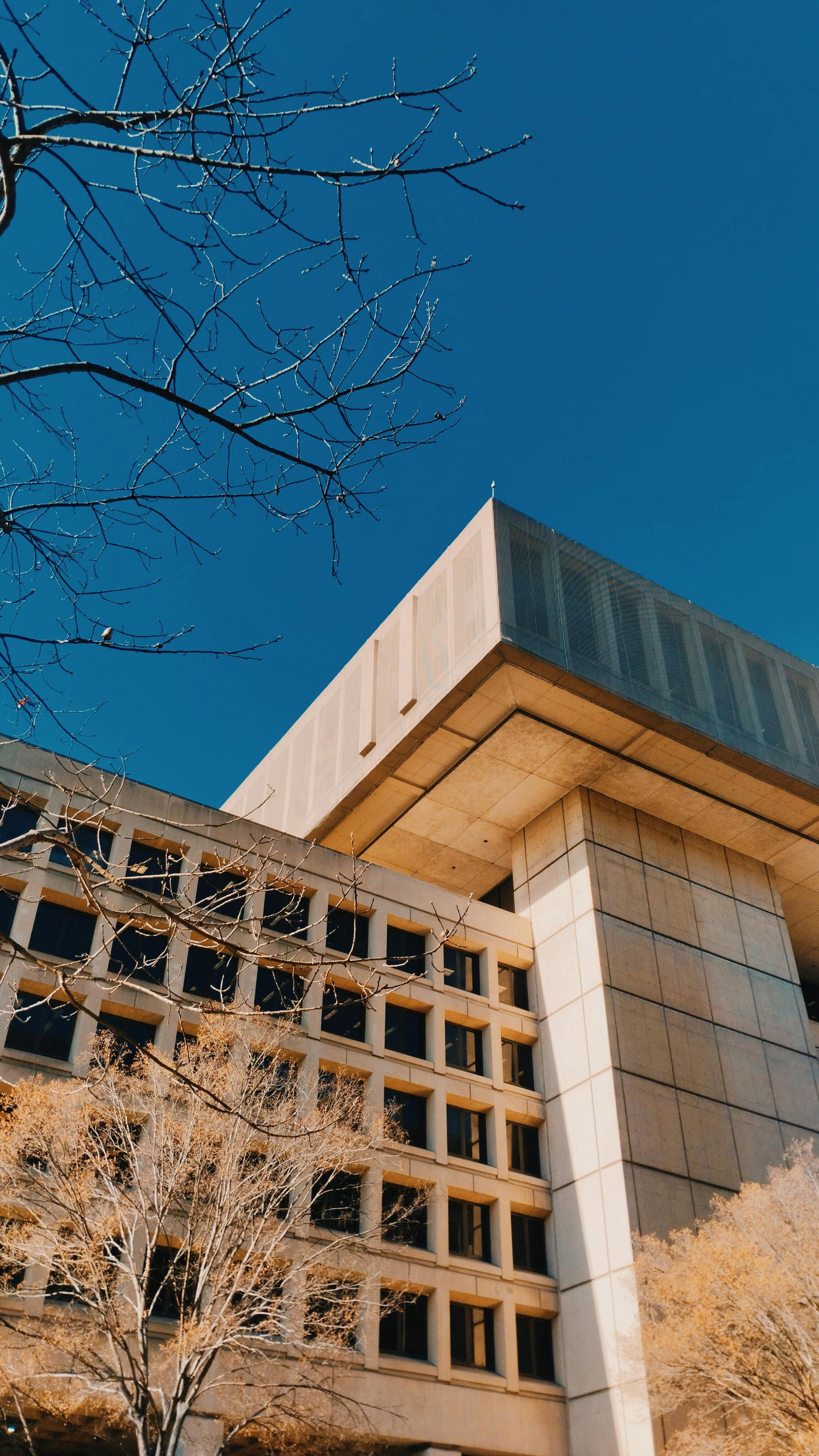 Exterior of the FBI headquarters building in Washington DC under a clear sky