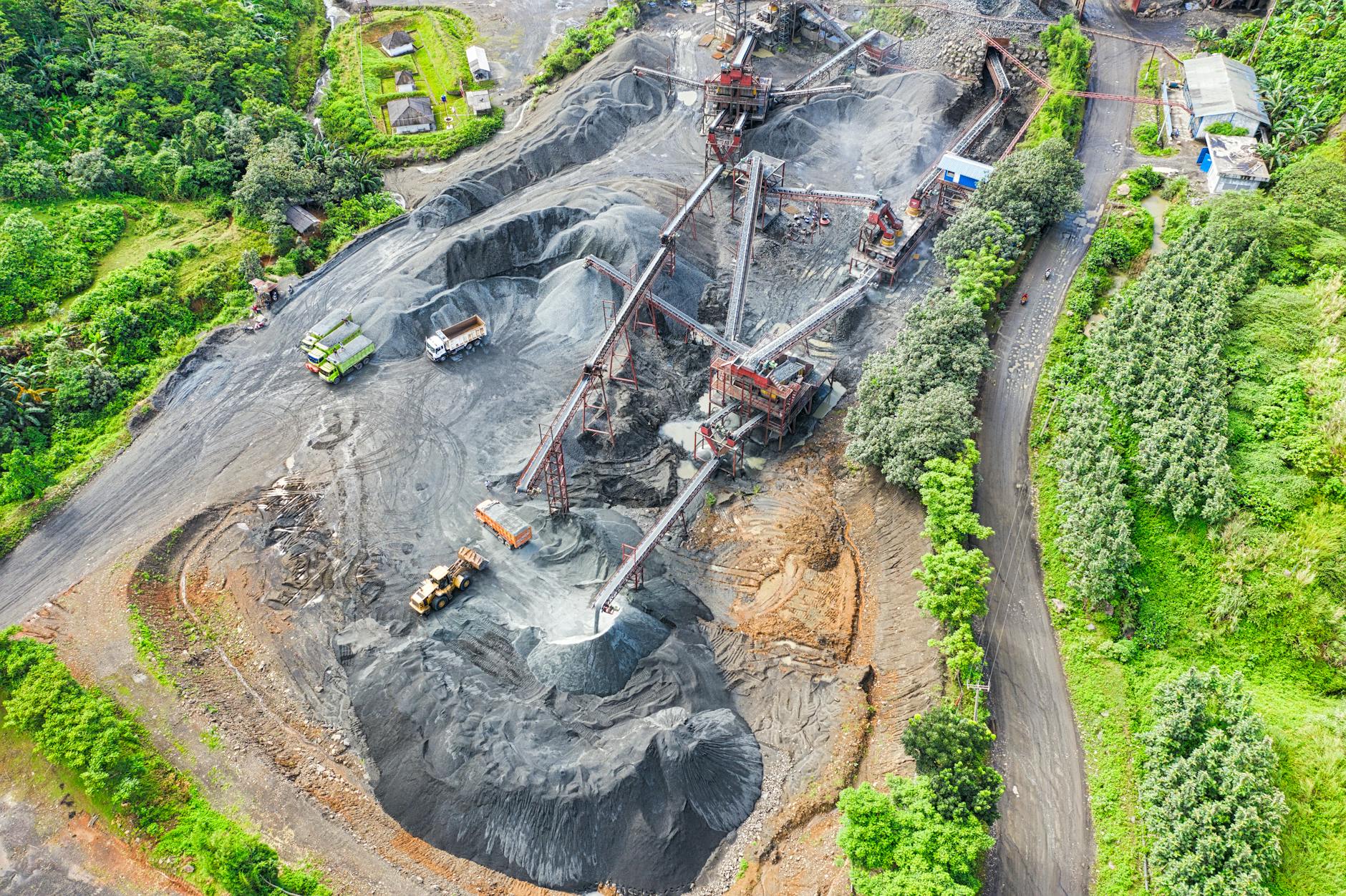 Aerial view of heavy equipment at an open-pit mining operation