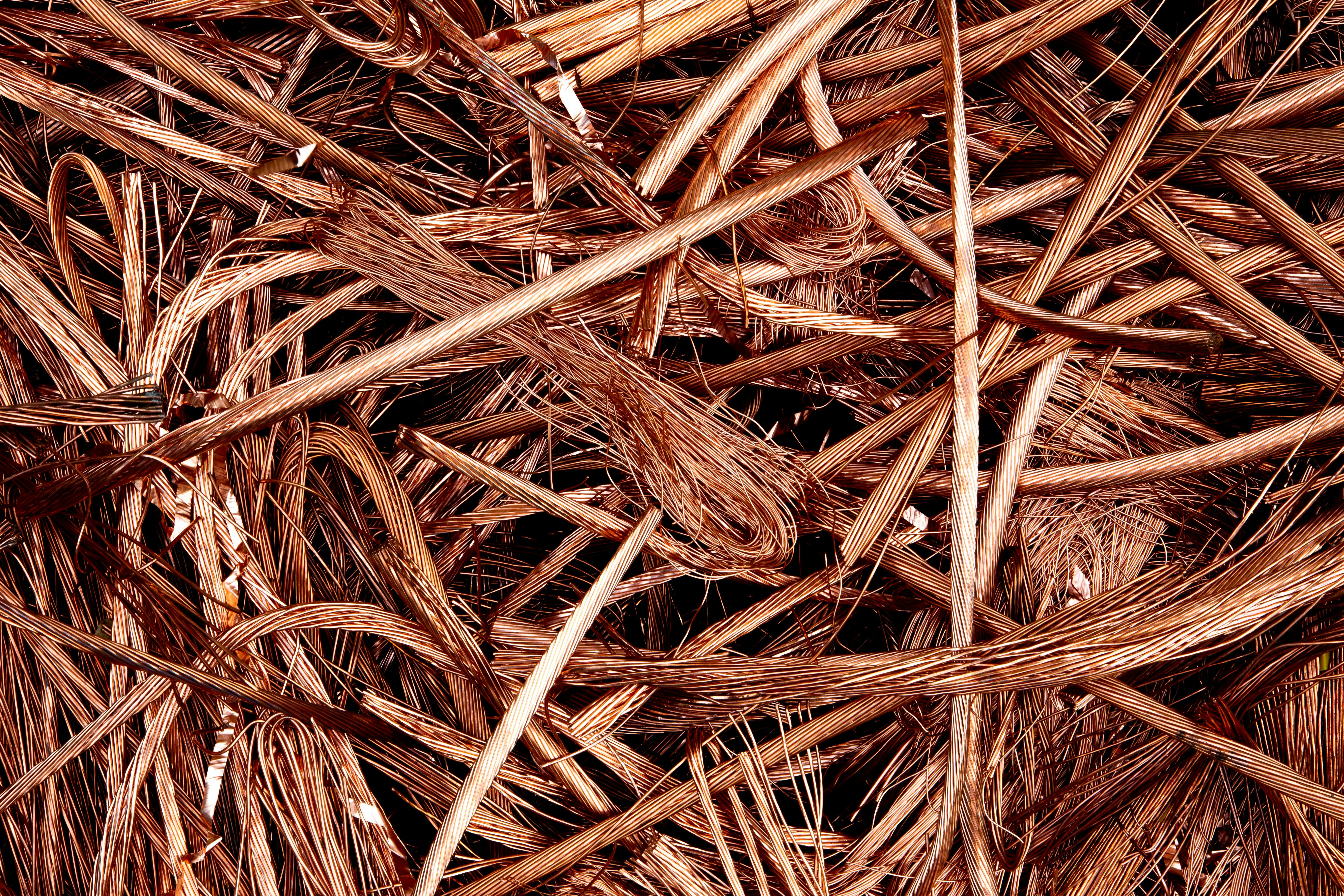 Close-up view of intertwined copper wires, representing the copper commodities market