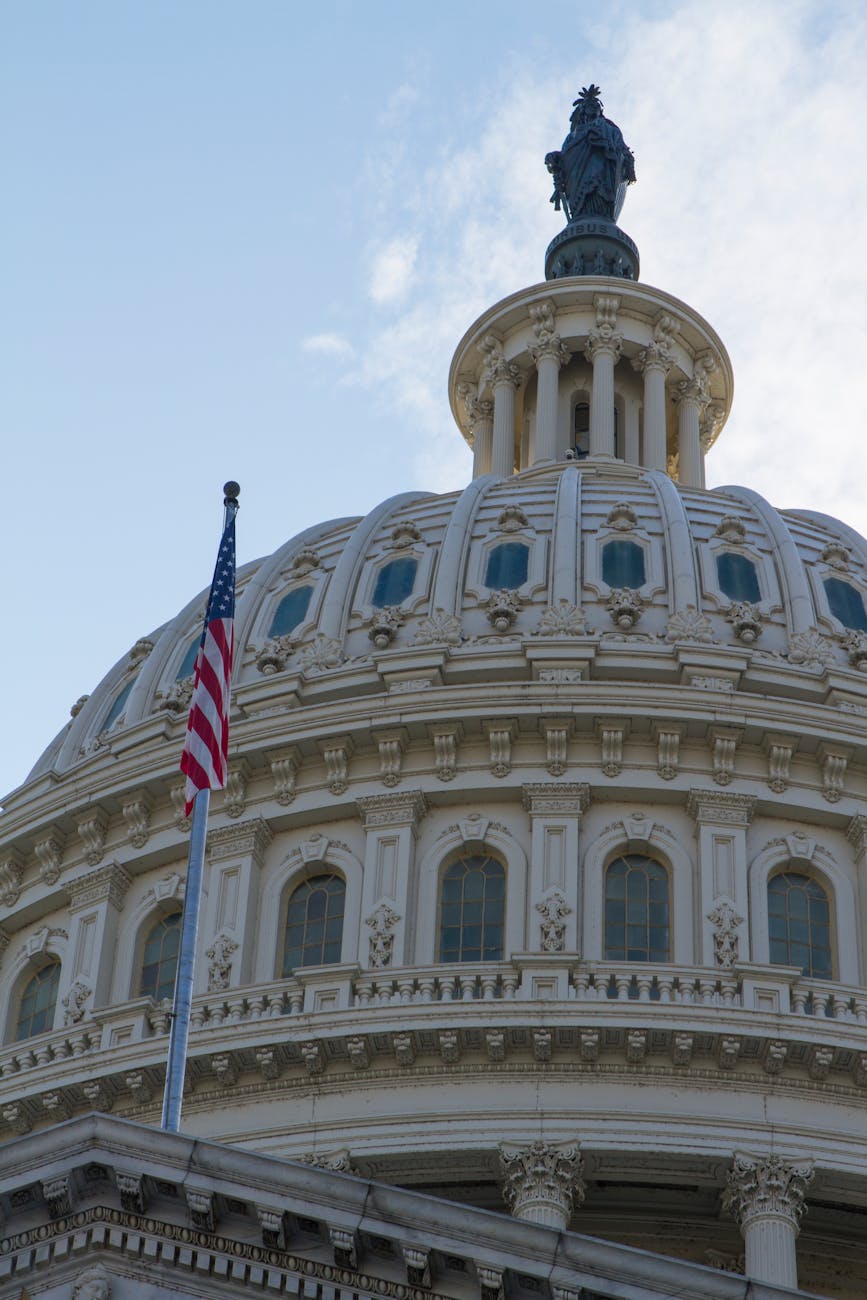 Close-up of the Capitol Dome with the US flag in Washington, DC