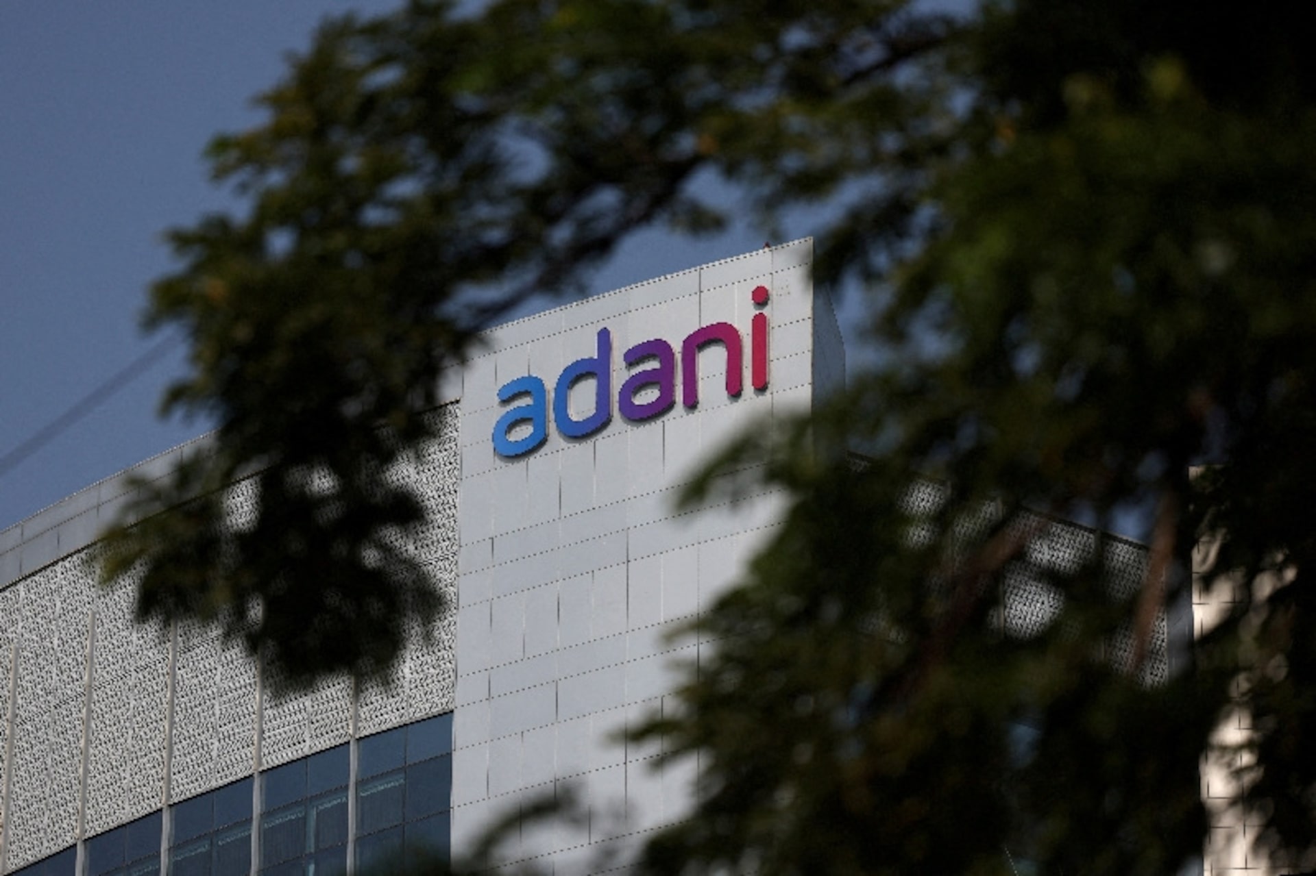 Adani Group logo on corporate house facade