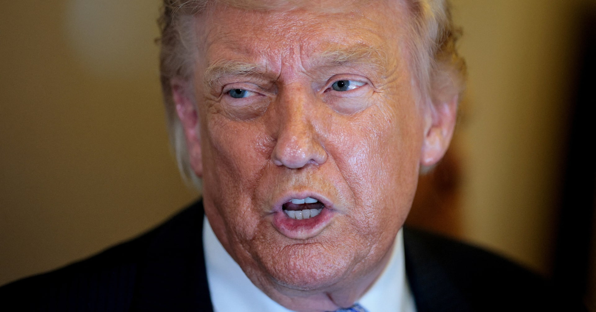 U.S. President Donald Trump speaks to the press aboard Air Force One en route to the U.S. after his official visit with President Xi Jinping in China, May 15, 2026.