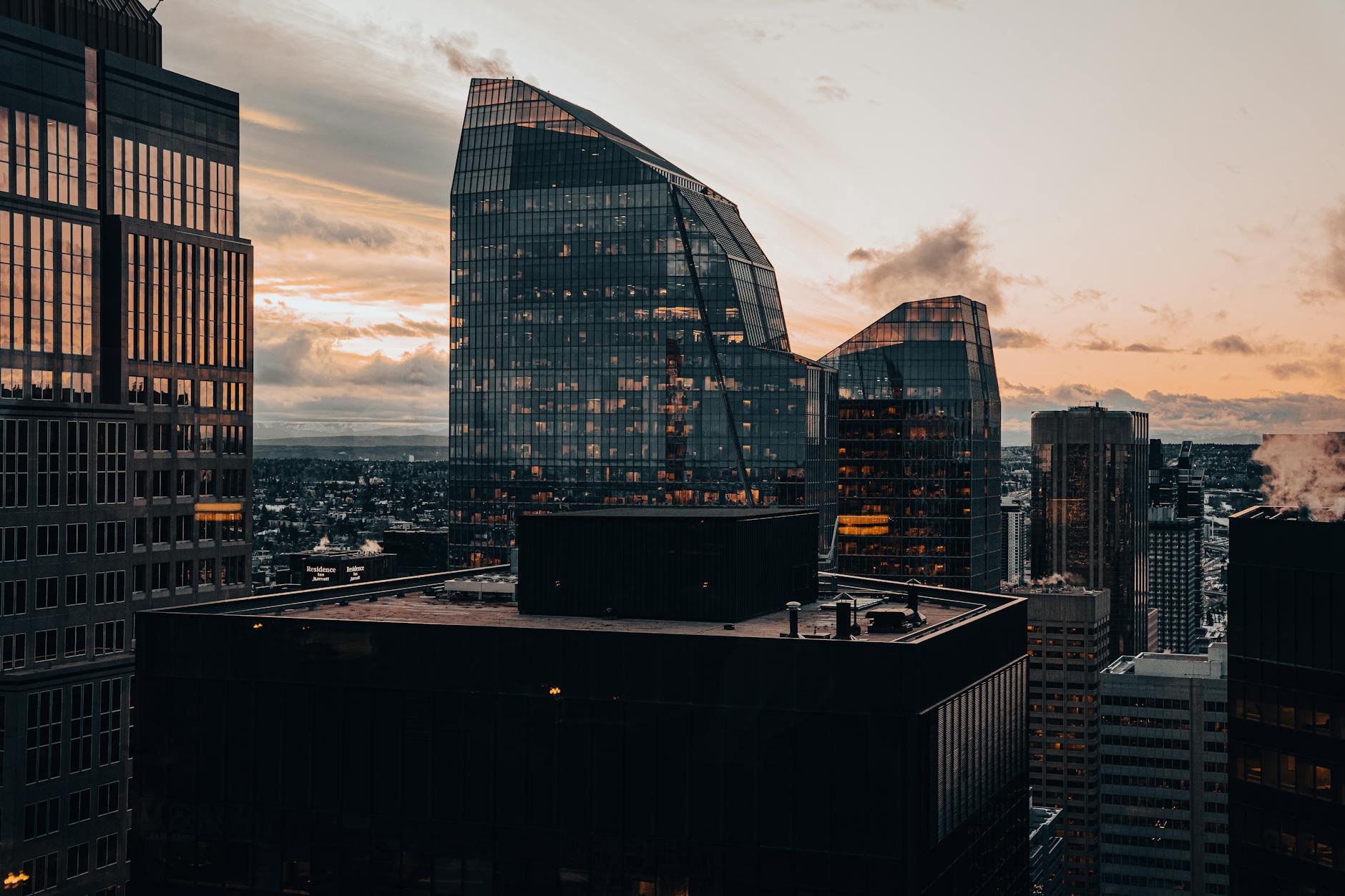 Stunning view of modern skyscrapers reflecting sunset colors, showcasing urban architecture.