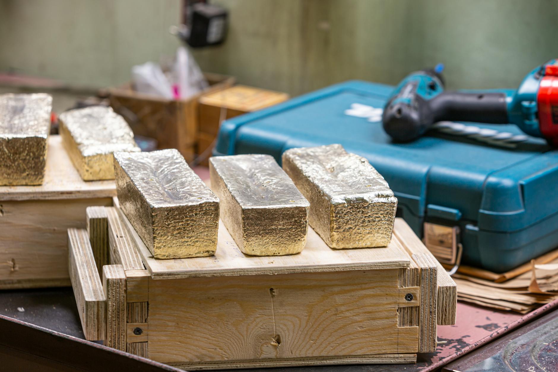 Gold bars stacked in a metals workshop