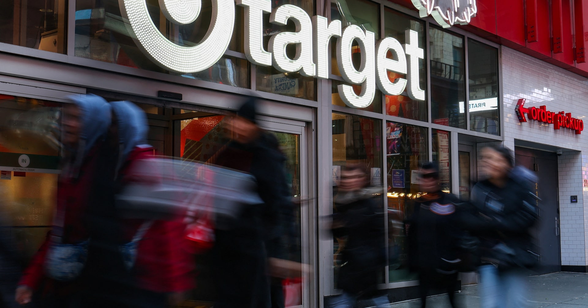 People walk by a Target store in New York