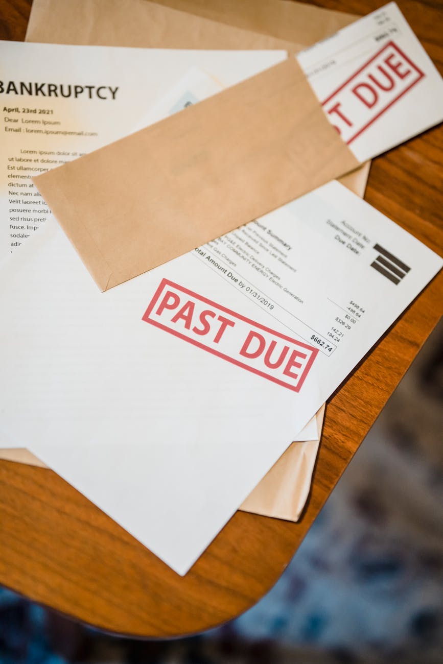 Private credit market stress illustrated with financial documents and calculator