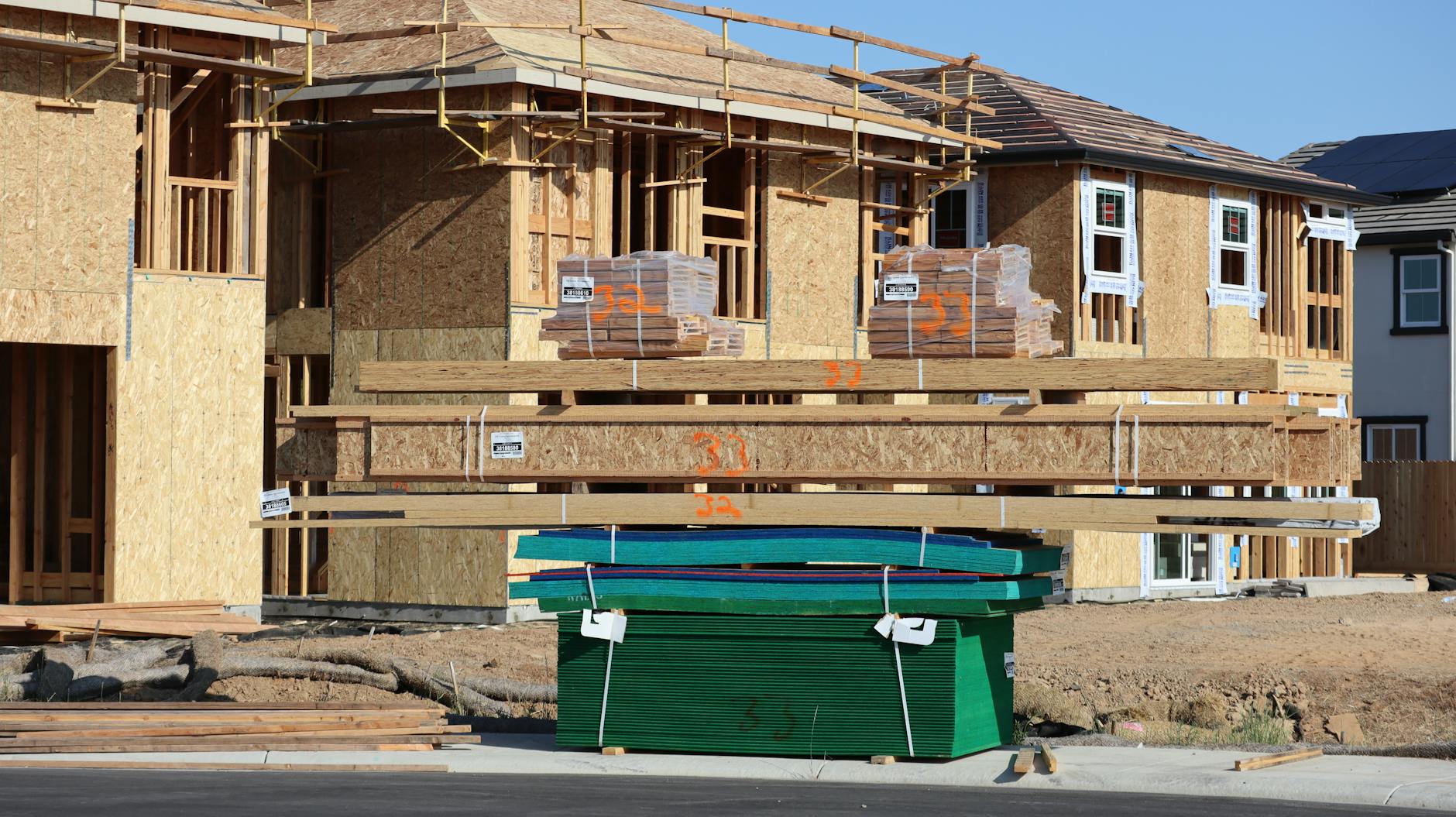 Wood-framed homes under construction at a California subdivision.