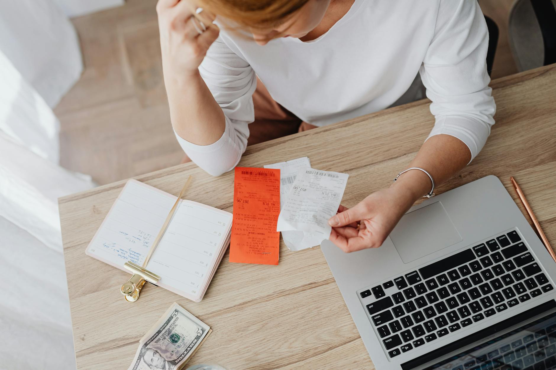 Borrower reviewing loan paperwork and finances