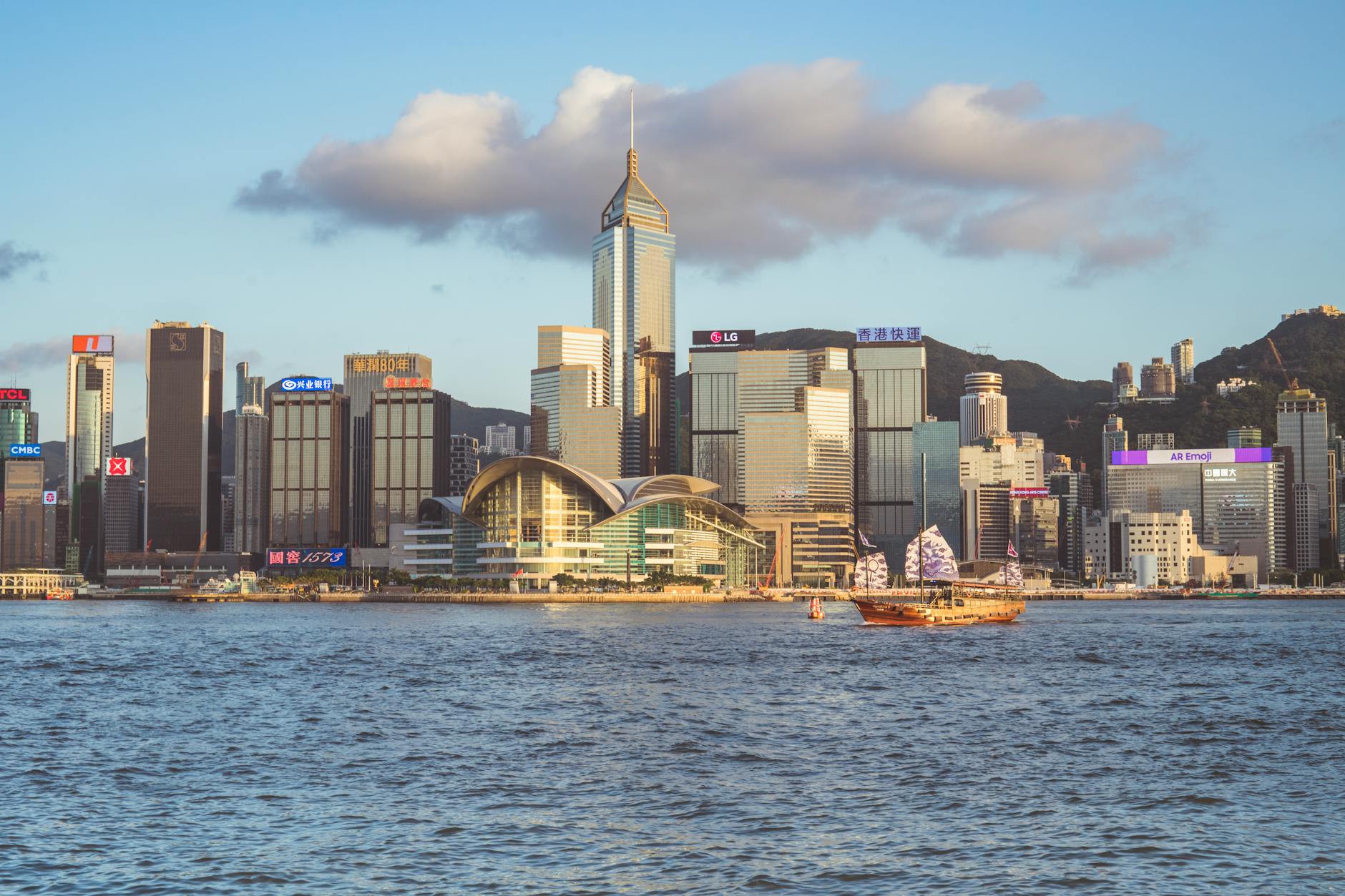 Skyline and illuminated financial district towers in Hong Kong at dusk