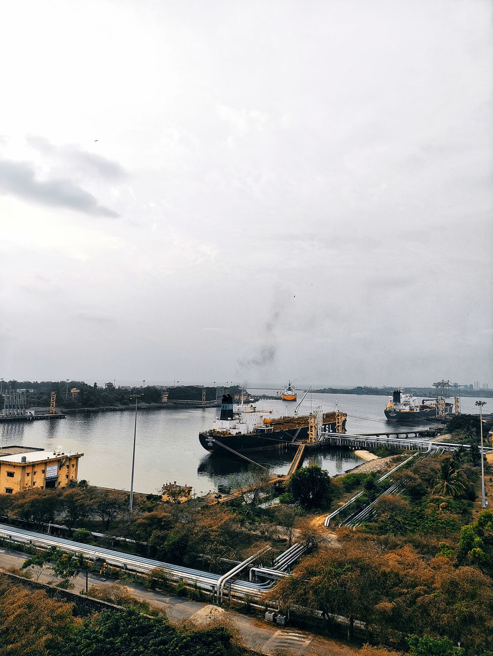 Oil tankers docked at Mangaluru port as Indian refiners shift crude sourcing after the Hormuz disruption.