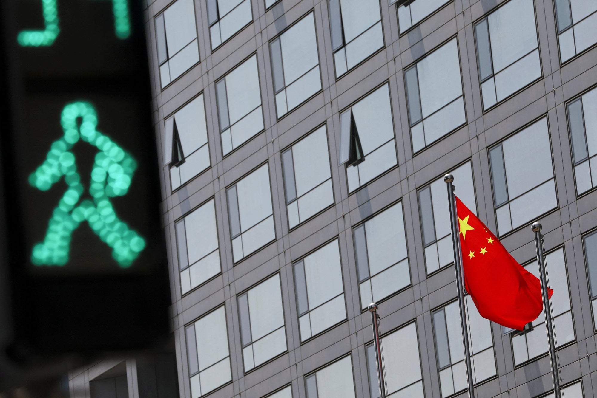 A Chinese national flag flutters outside the CSRC building in Beijing. Photo: Reuters
