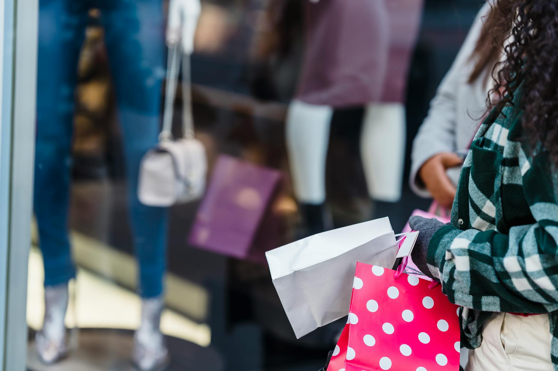 Chinese consumer-brand dealmaking illustration with shopping bags and retail storefronts