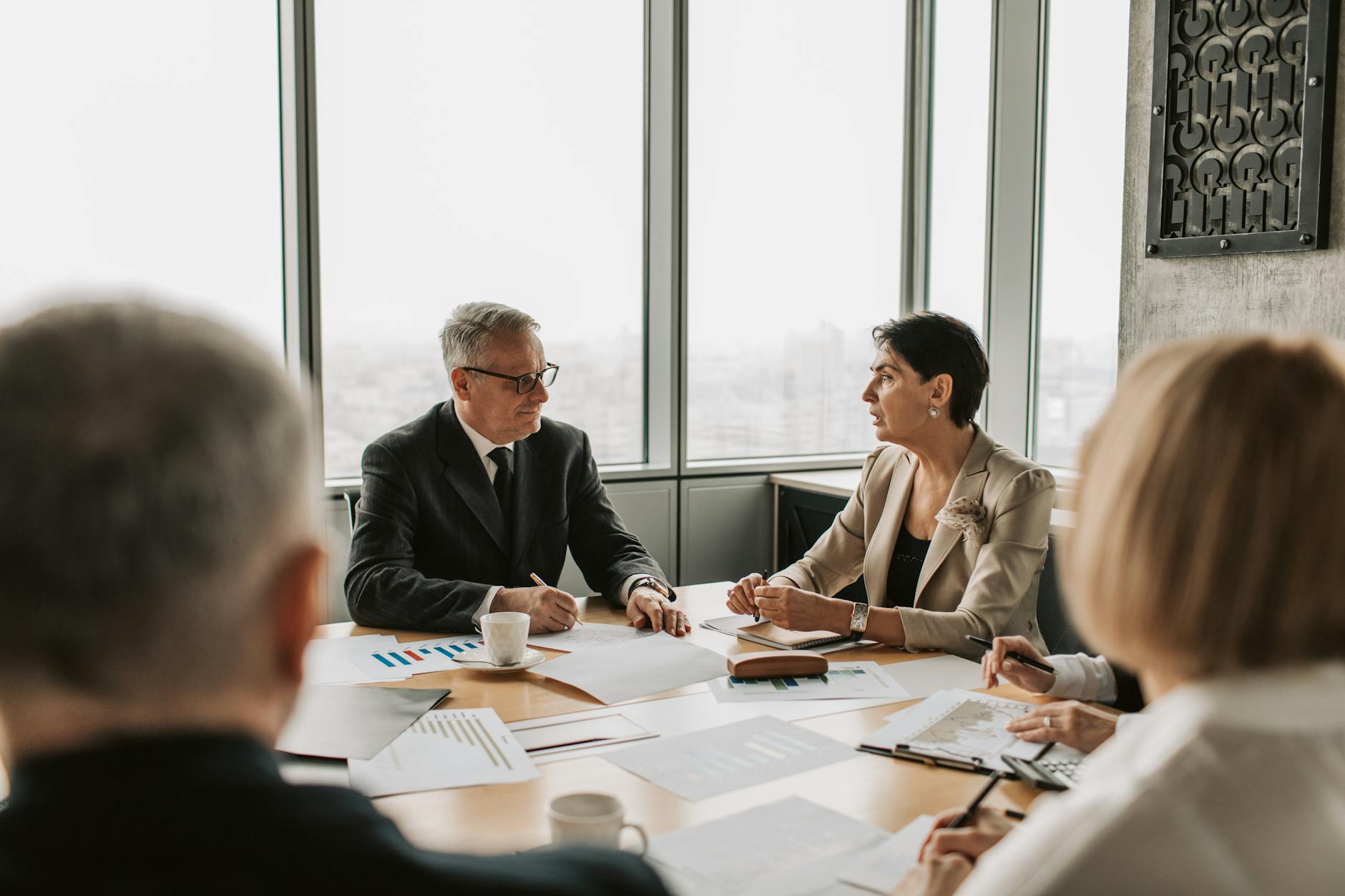 Business professionals in a strategy meeting, illustrating private-credit fund decision making