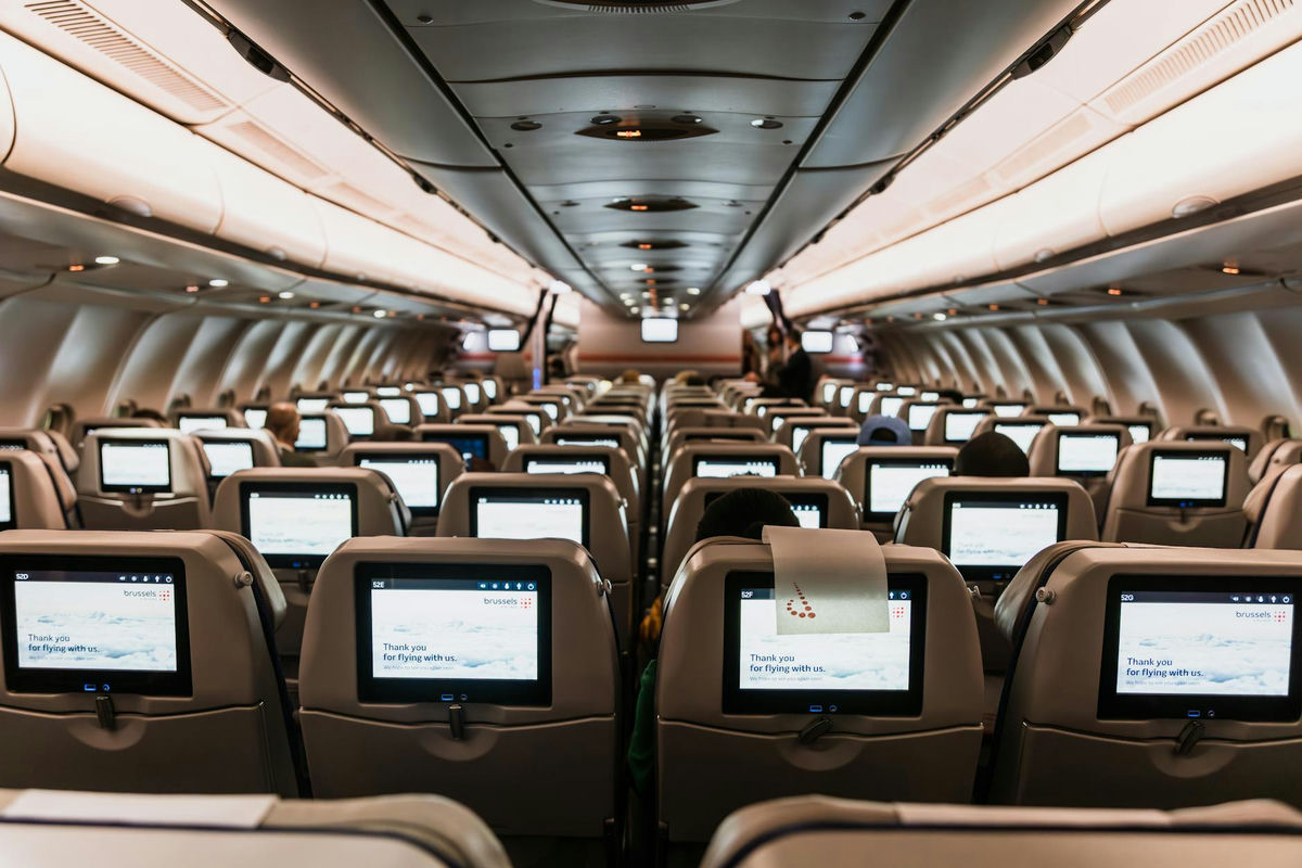 American Airlines cabin with seatback screens, the kind of narrow-body interior where faster Wi-Fi becomes a competitive selling point.