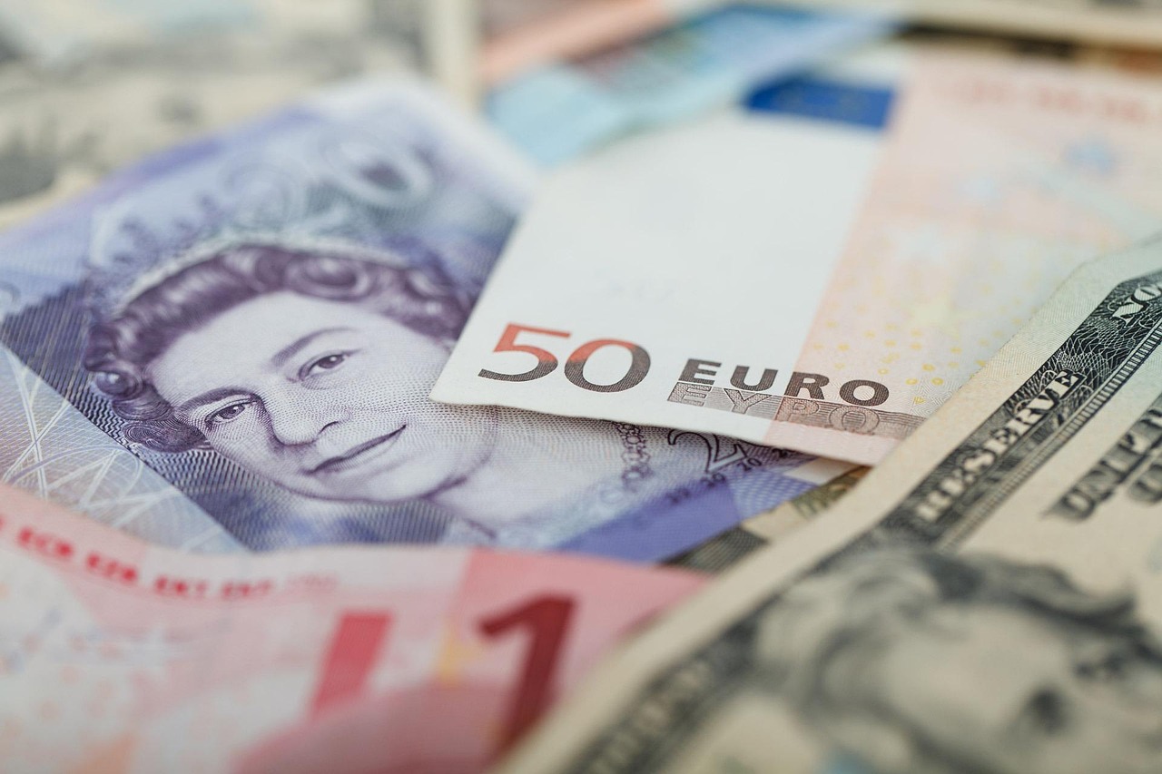 Mixed international banknotes and currencies laid out for foreign-exchange trading