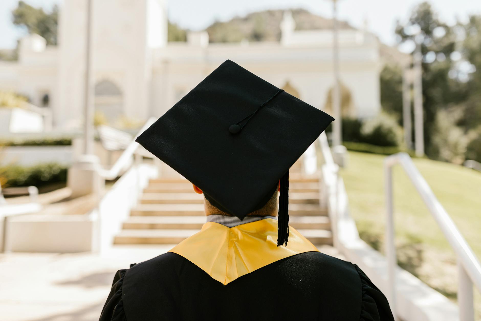 Graduates reviewing student-loan paperwork as federal repayment rules tighten