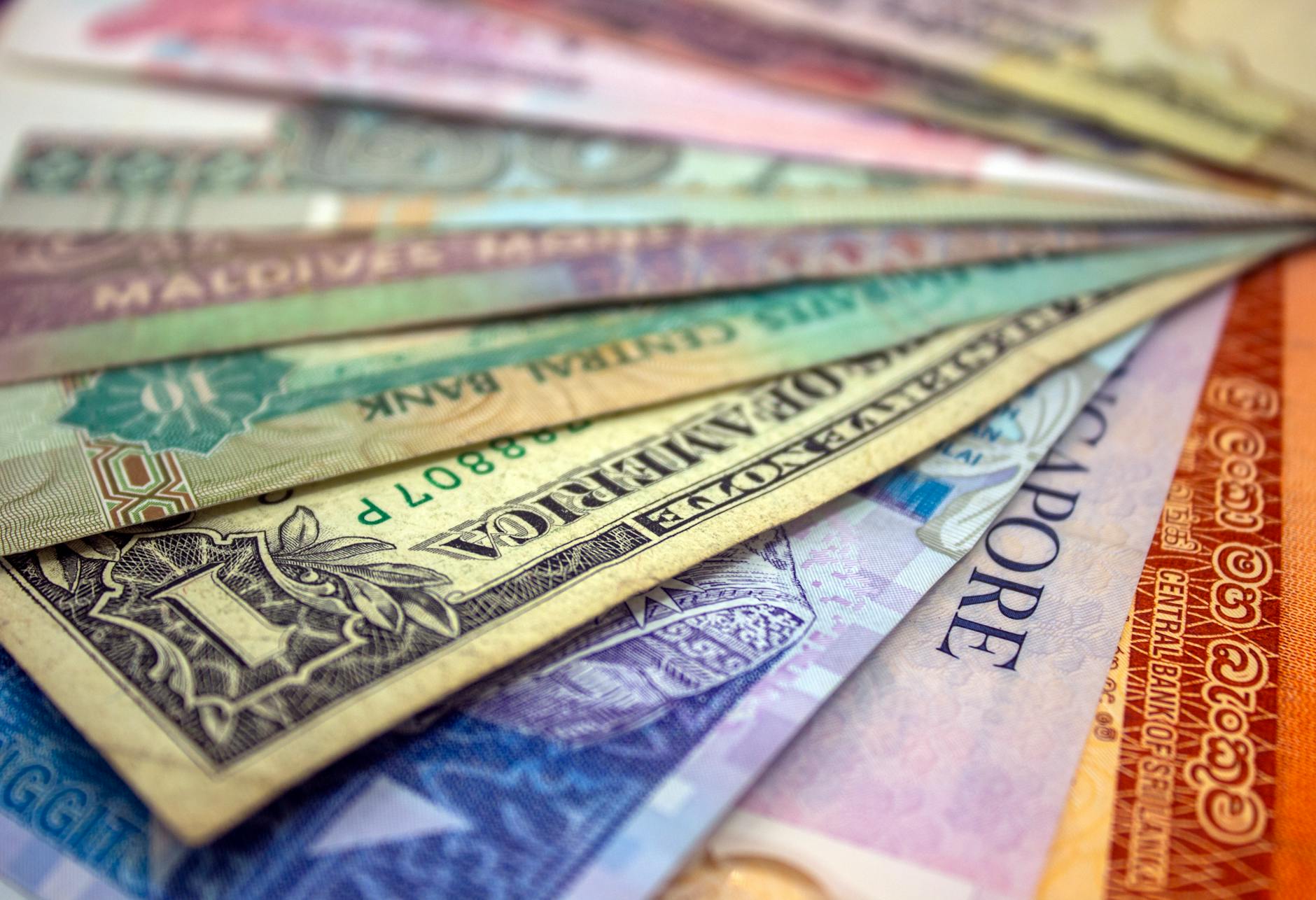 International banknotes laid out together, illustrating the broad emerging-market currency backdrop.