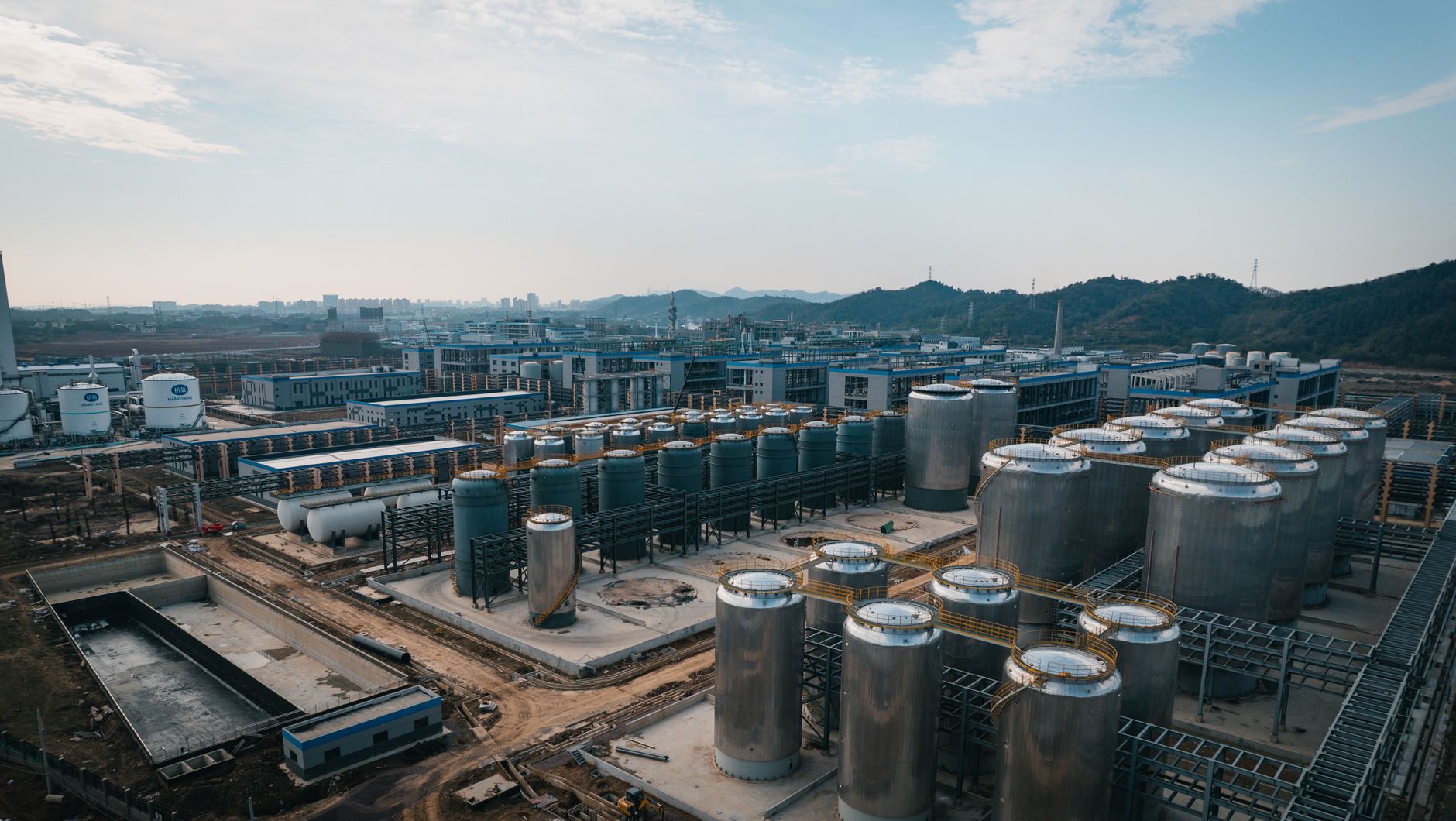 Aerial view of an industrial complex in China with storage tanks and factory buildings