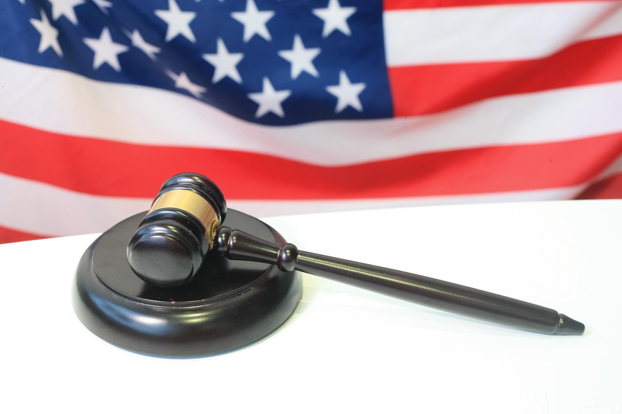 Gavel and US flag representing litigation risk for AI companies