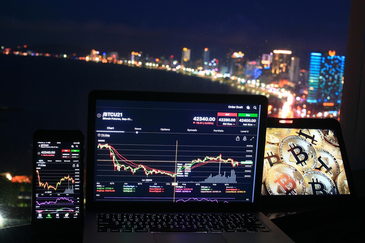 Bitcoin and stock trading screens signal competing demand for speculative liquidity.