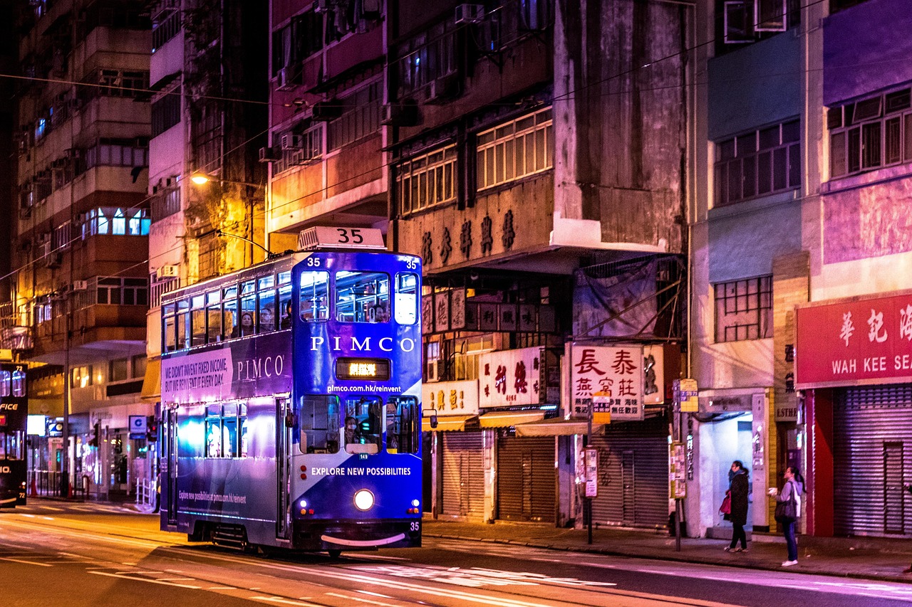 Hong Kong financial district at night as capital shifts between markets
