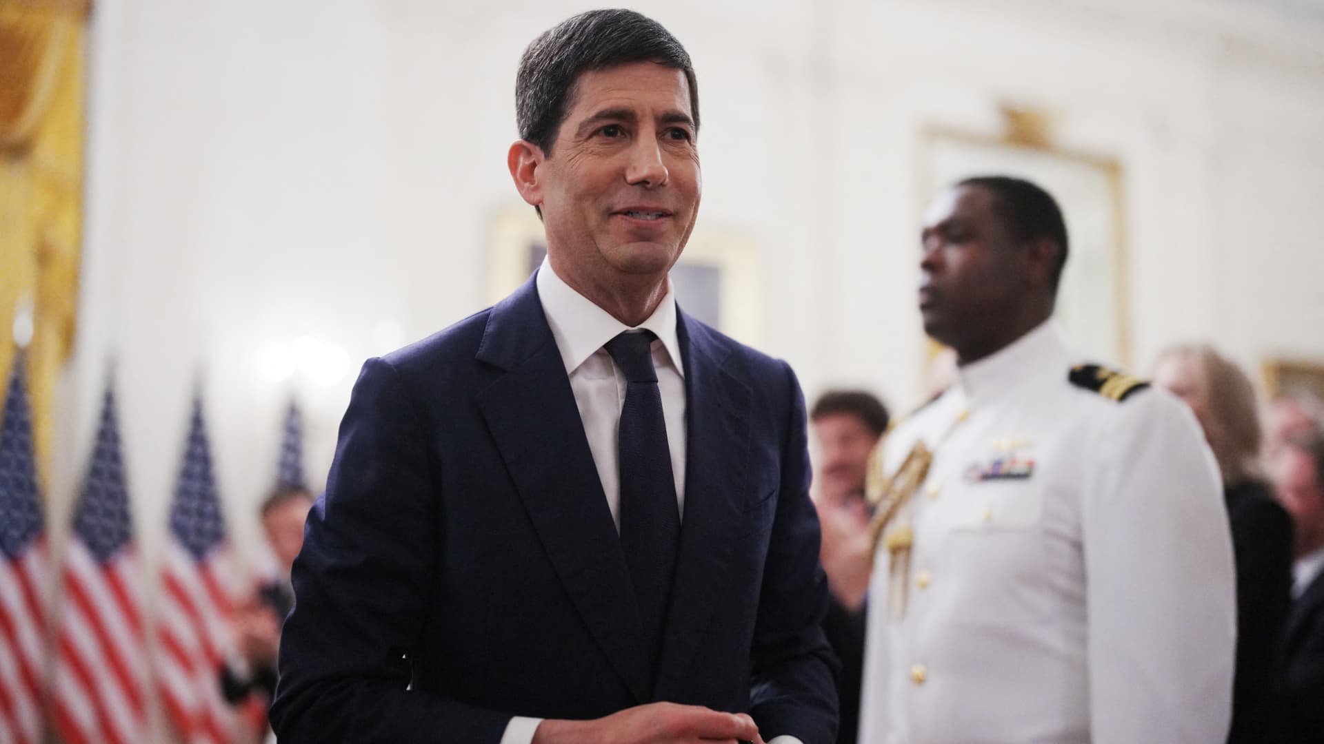 Kevin Warsh departs the East Room after a swearing-in ceremony