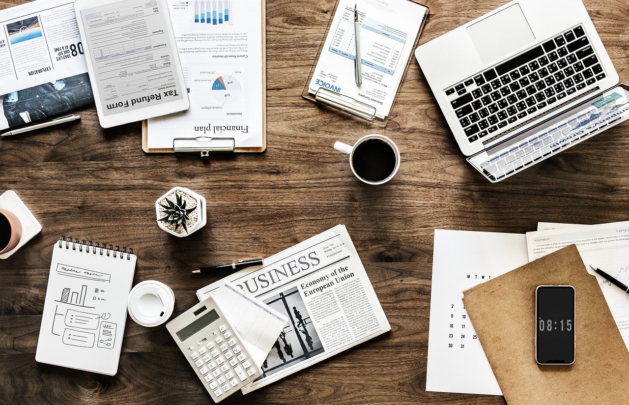 Financial documents and planning notes on an office desk