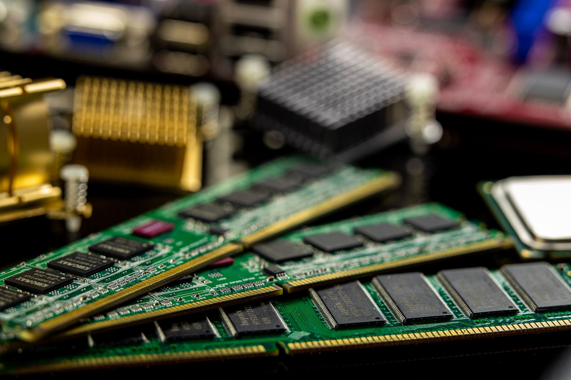 Memory sticks and microprocessors on a motherboard, representing AI infrastructure hardware