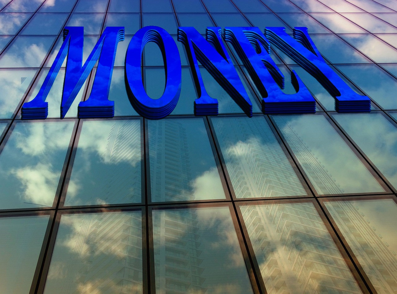 Financial district office facade reflected in glass, illustrating private-credit market pressure