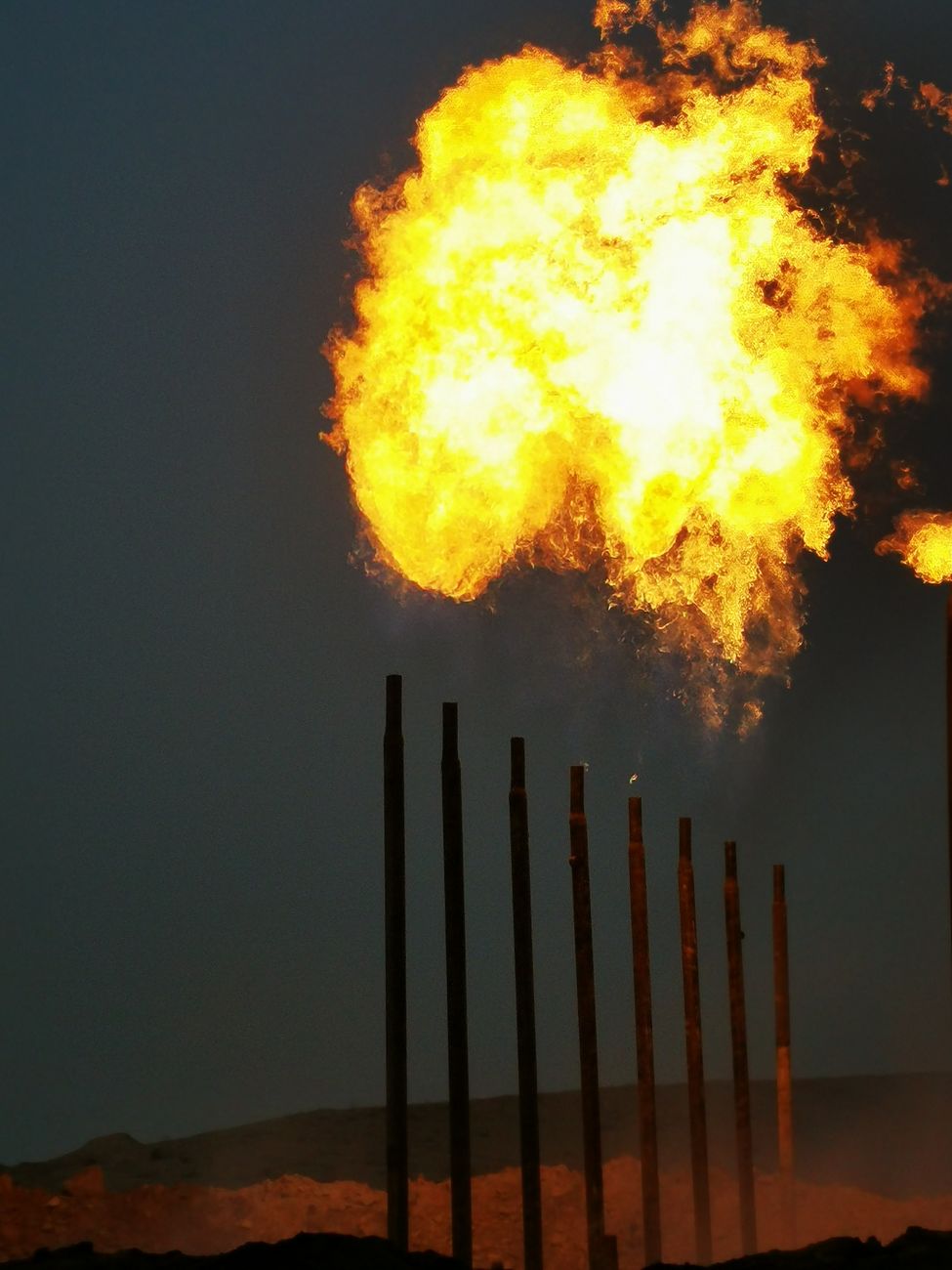 Oil rig at sunset — symbolic image for crude oil market coverage