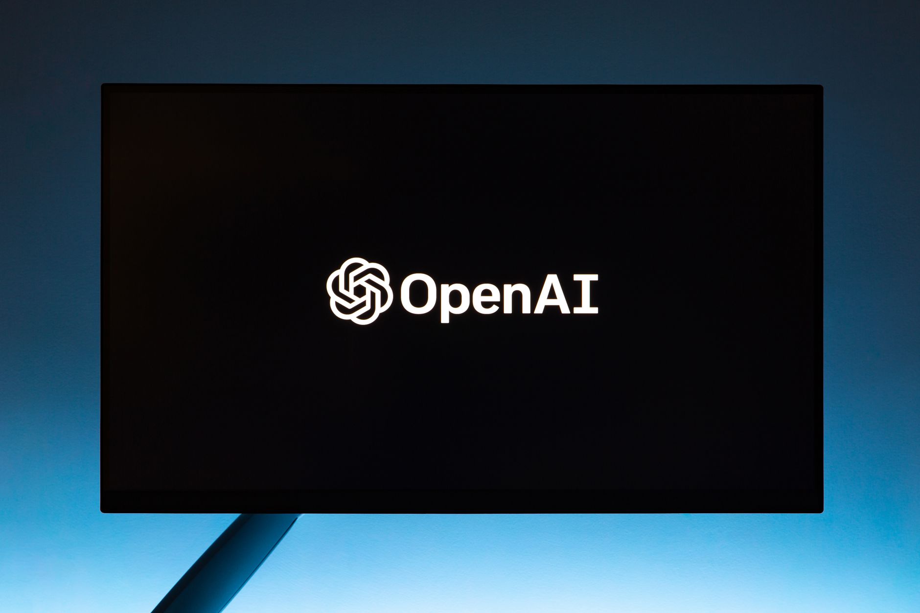 OpenAI logo on a monitor as AI companies prepare for public listings