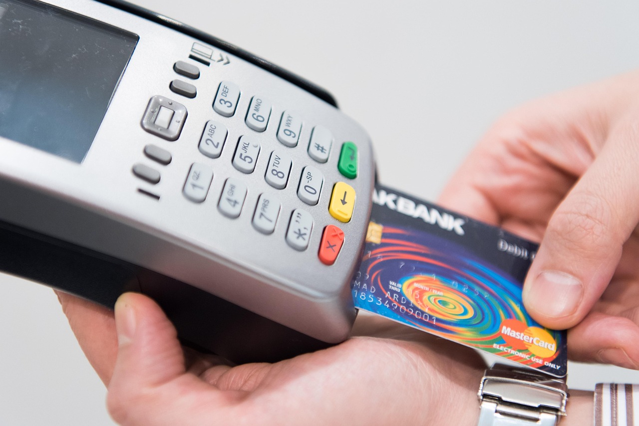 Card-payment terminal and bank card, illustrating disruption to card-based banking services.