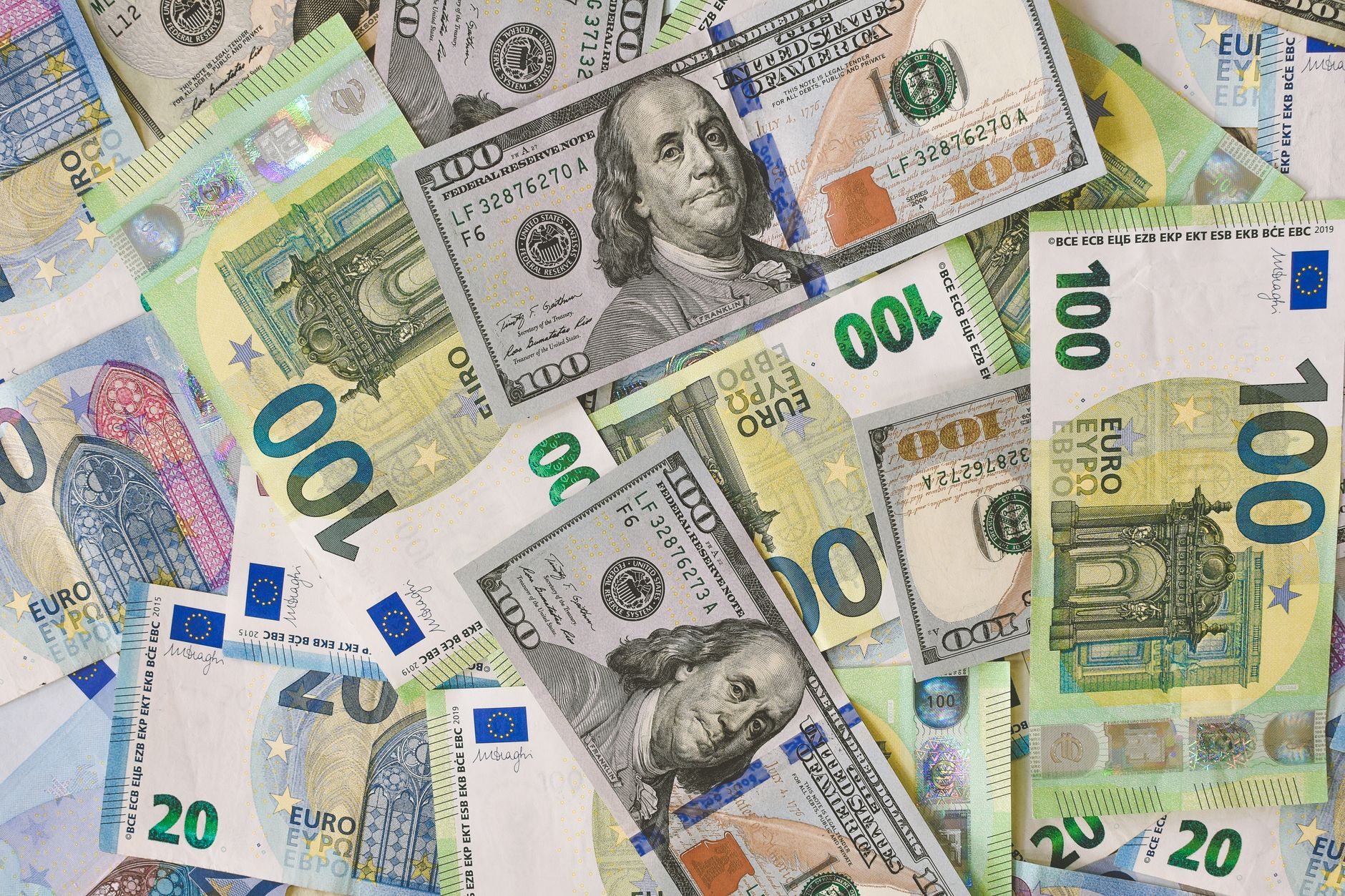 Euro and dollar banknotes illustrate the relative-value trade at the centre of the latest EUR/USD repositioning.