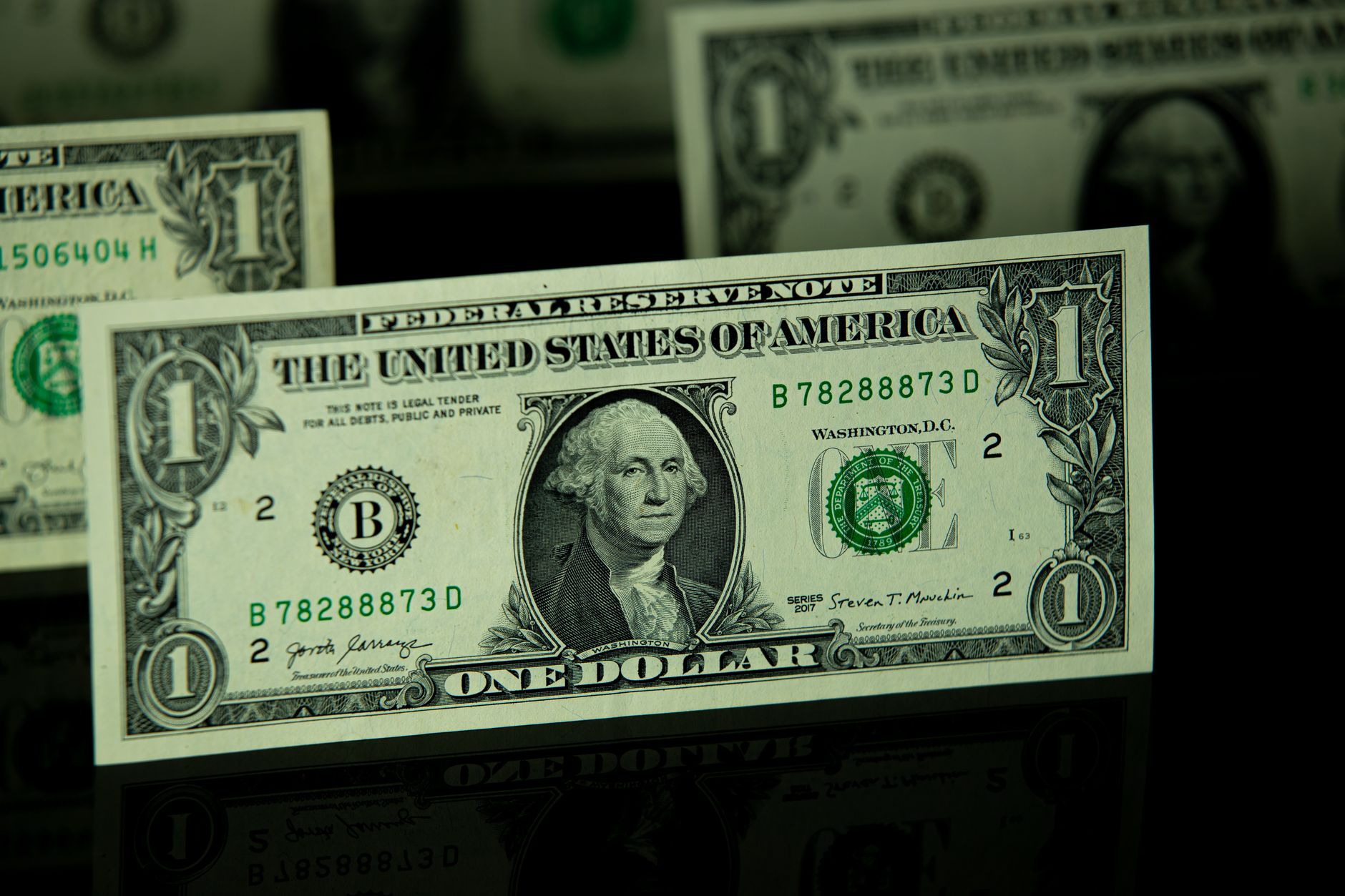 Detailed close-up of a one dollar bill, illustrating U.S. Treasury and rate-market coverage
