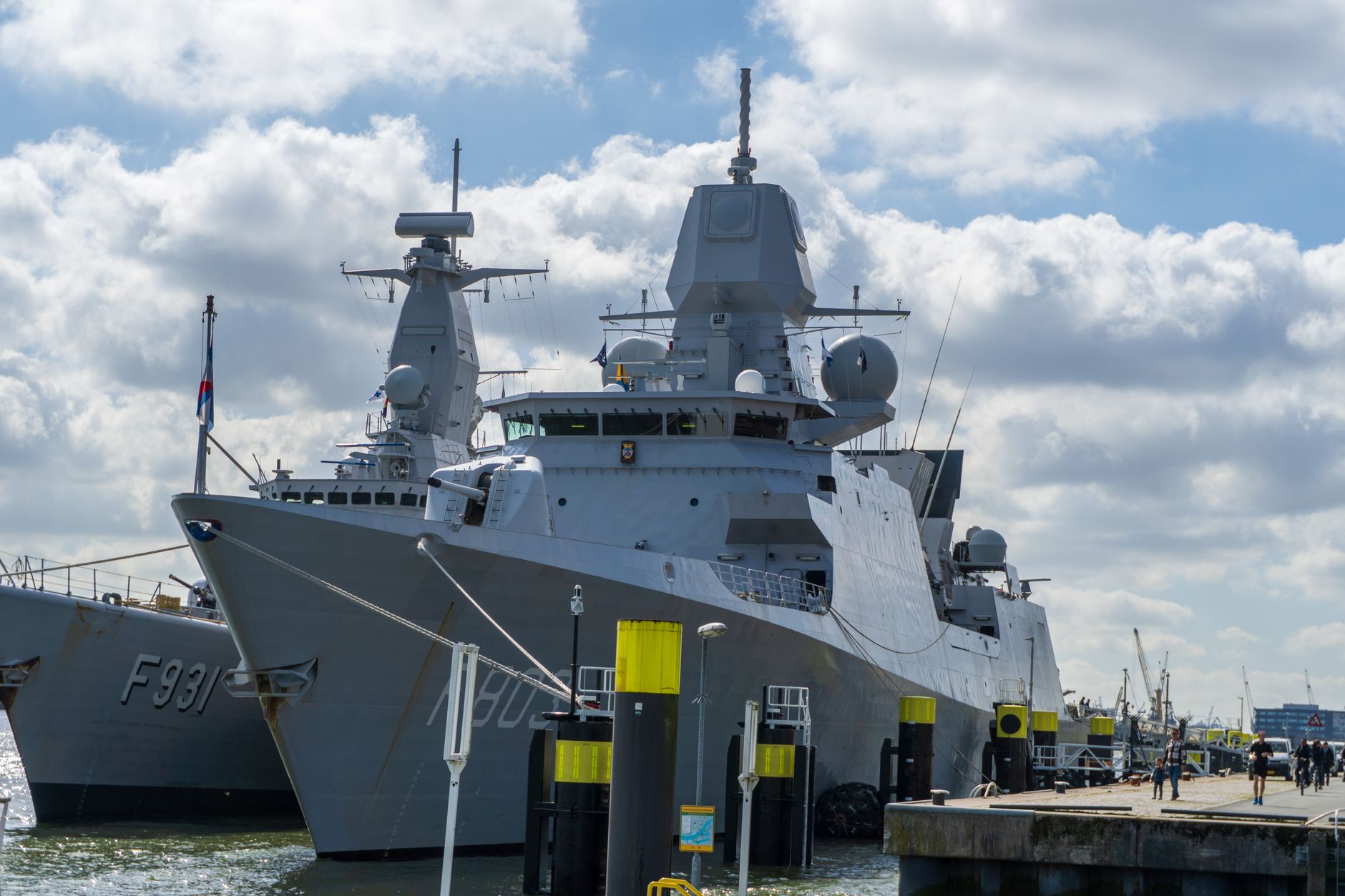 A modern naval warship docked in Rotterdam, illustrating the naval programmes European suppliers are chasing.