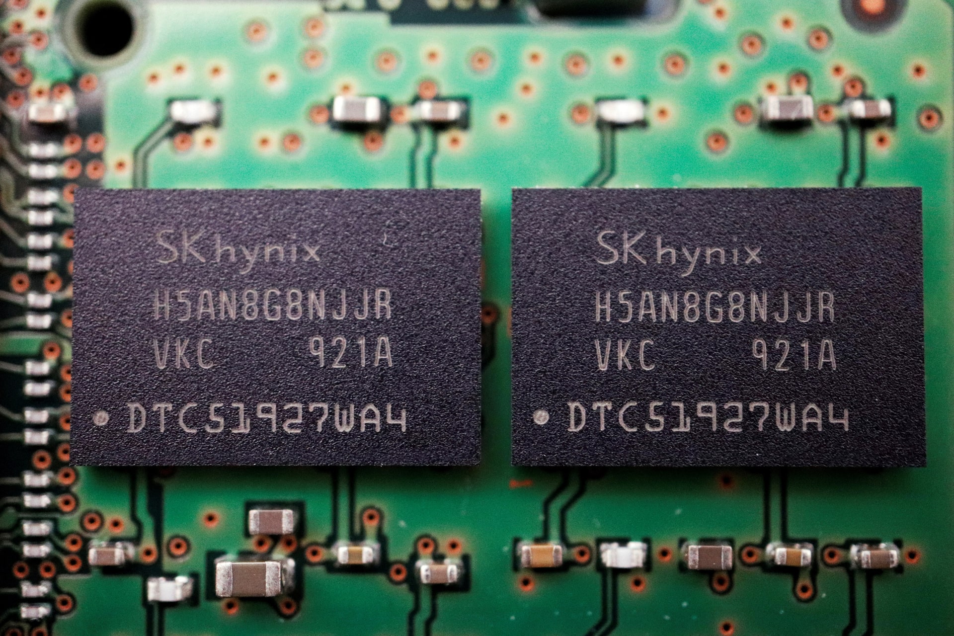 SK Hynix logo at a chip display, reflecting the company's push to bring its AI memory story to U.S. investors.