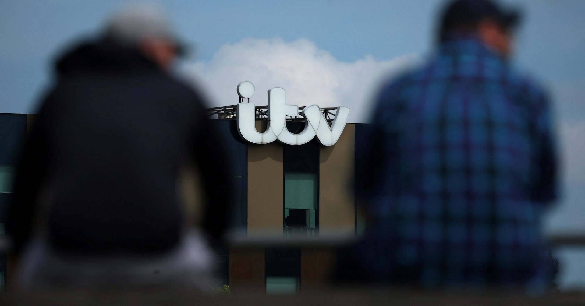Signage is seen on the side of an ITV office building at Media City in Manchester, Britain