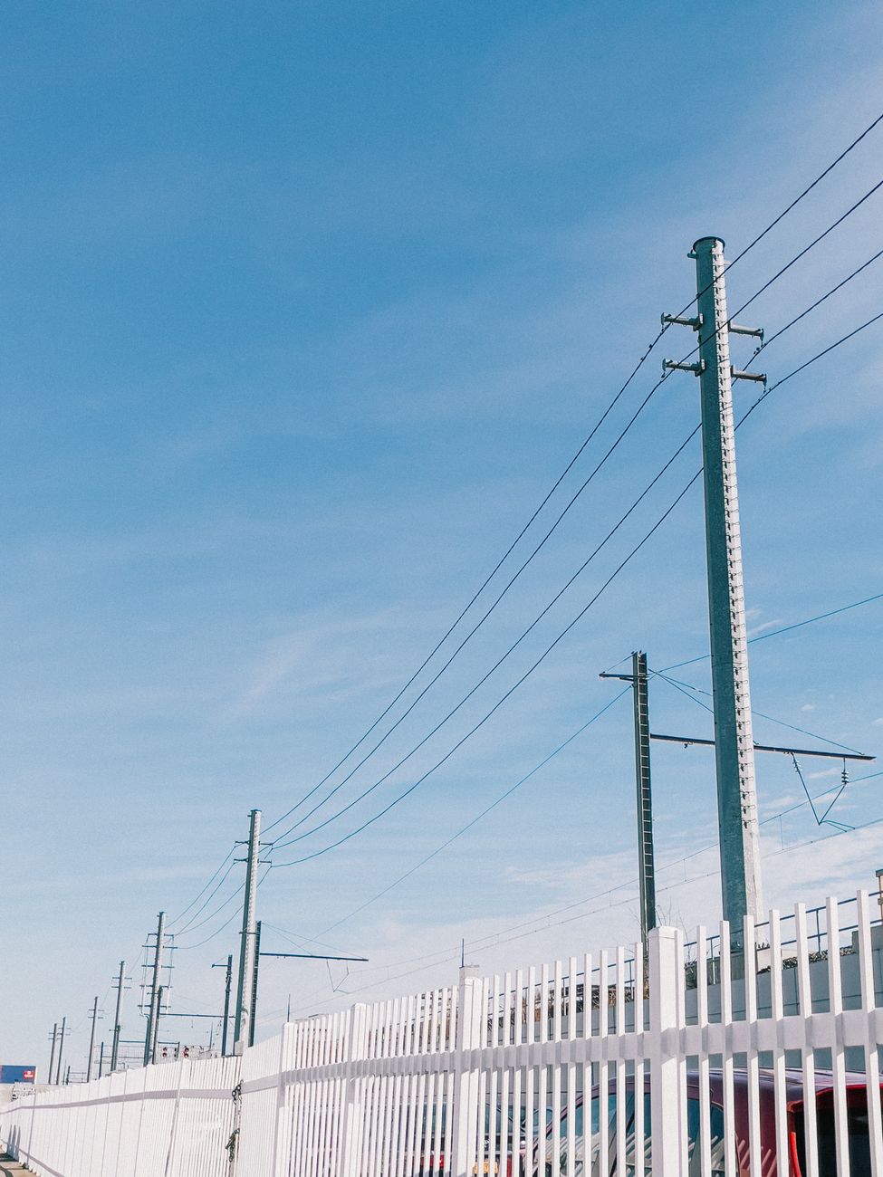 Utility poles and power lines in New York, reflecting the grid constraints behind new data-center permits.